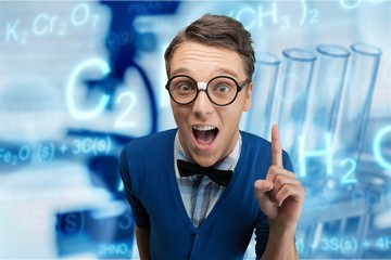 Young nerd man posing on background