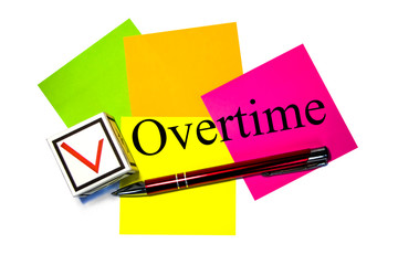Overtime - checkmark. White paper cube with colorful stickers and pen. The concept of the checklist. Isolated.