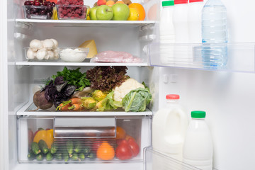 fruits, vegetables and meat inside the refrigerator, background, close-up