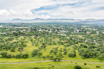 Aerial view of the green lands and mountains, view from the top of Pyramid of the Sun, the largest ruins of the Mesoamerican pyramids  in Teotihuacan, an ancient city located in Valley of Mexico