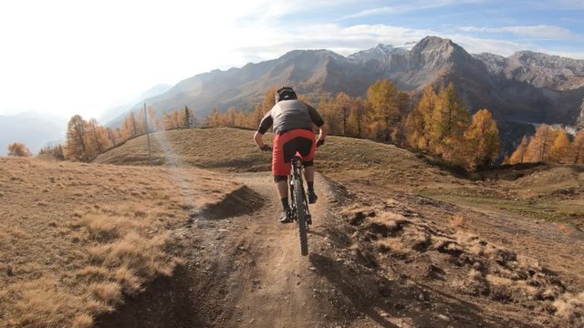 Following mountain biker on trail with small jumps - Gopro 7 shot at 4K60 - ultra smooth stabilization - slight slow motion to 50fps