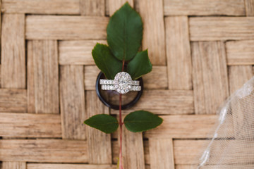wedding rings held by leaf - 299128928