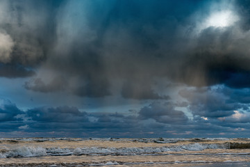 Big clouds over Baltic sea in autumn morning.