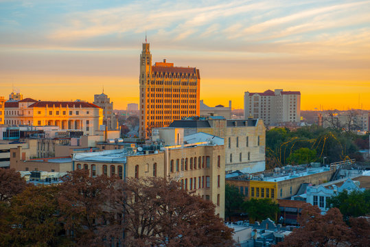 Historic buildings in downtown San Antonio including Emily Morgan Hotel at sunrise twilight in downtown San Antonio, Texas, USA.