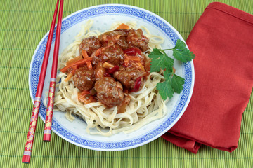 beef dumplings sweet and sour sauce and noodles