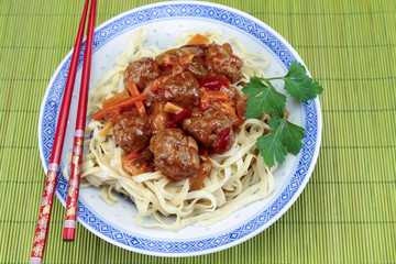 beef dumplings sweet and sour sauce and noodles
