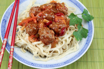 beef dumplings sweet and sour sauce and noodles