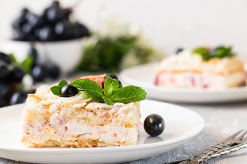 Pavlova on a biscuit with a gentle curd cream and fruit.