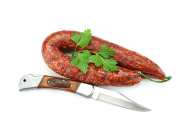 whole chorizo on a white background