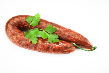 whole chorizo on a white background