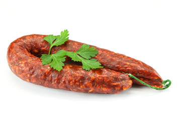 whole chorizo on a white background