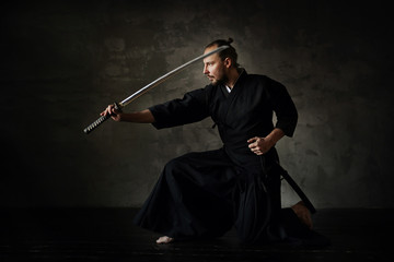 Studio portrait of man with sword