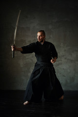 Studio portrait of man with sword © arhar