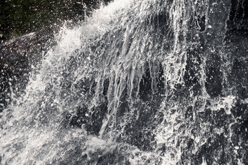 spray and jet of a waterfall
