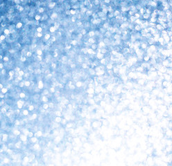 The Glittering glitter background with a bokeh.