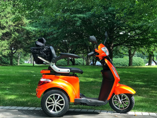 An orange electric scooter