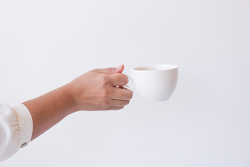 Woman hand holding white cup hot espresso coffee menu isolated on white background.Hot drink menu...