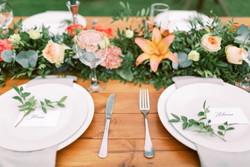 Table setting for an event party or wedding reception. Table settings for a luxury wedding. Outdoor...