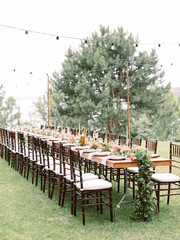 Table setting for an event party or wedding reception. Table settings for a luxury wedding. Outdoor wedding