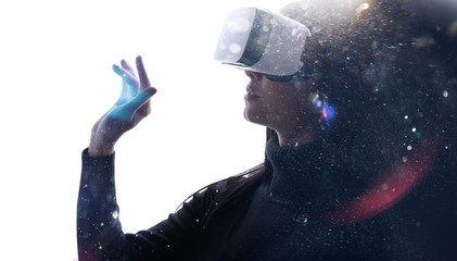 Naklejka premium Double exposure of female face. Abstract woman portrait. Digital art. Beautiful female in VR helmet scrolling invisible screen while interacting with virtual reality under neon light.