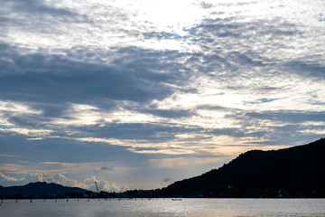 The sea the evening amidst the clouds and the sky is beautiful quiet atmosphere feeling lonely