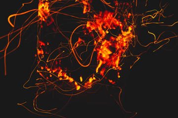 Fire flames with sparks in the dark background