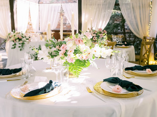 Table setting for an event party or wedding reception. Table settings for a luxury wedding. Outdoor wedding