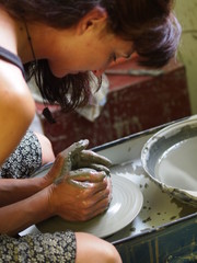 A girl molding pottery in her hands / handicarfts at home / Creating Pottery With Clay
