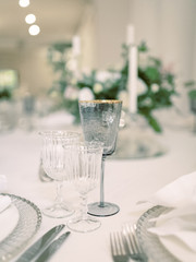 Table settings for a luxury wedding reception. Outdoor wedding