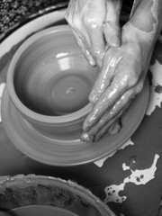 Making Ceramic Molds: Hands molding pottery. Mugs made of clay