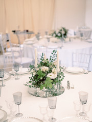 Table settings for a luxury wedding reception. Outdoor wedding