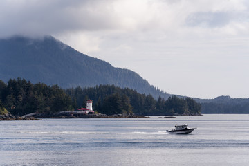 Lighthouse and speed boat on lake in Sitka Alaska 