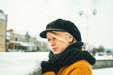 Portrait of cute blond girl in winter clothing. Winter time, fashion