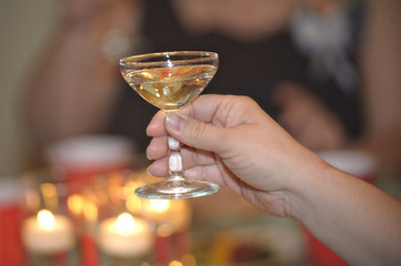 glass of champagne in hand during toast