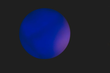 Glowing sphere in the dark. round shape template with color backlit