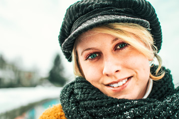 Portrait of cute blond girl in winter clothing. Winter time, fashion