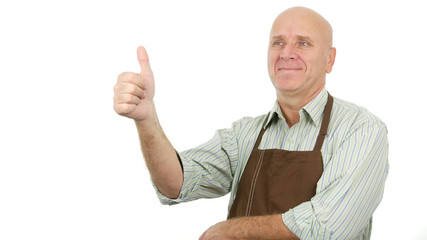Image with a Smiling Person Wearing Apron and Thumbs Up