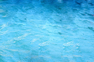 surface of water in swimming pool, refreshing blue swimming pool.