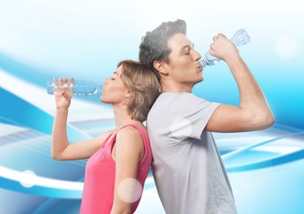 Couple drinking water after workout