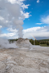 Castle geyser catches a rainbow in Yellowstone