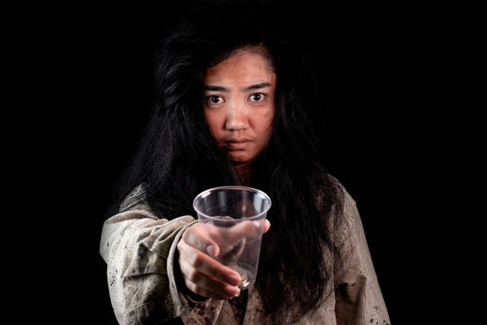 Young and dirty beggar asking for some money