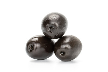 Group of three whole canned black olive isolated on white background