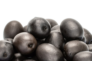Lot of whole spicy canned black olive isolated on white background