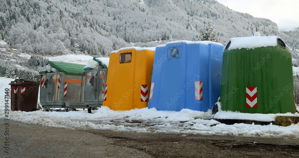 Wall mural bins for the collection of waste in the mountain town