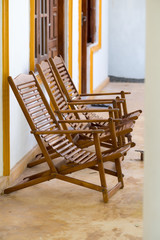 Wooden chairs outside asian guest house