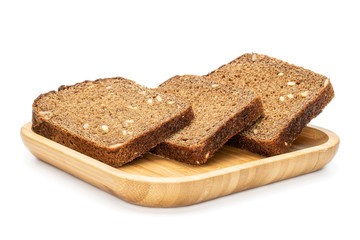 Group of three slices of fresh baked dark bread on wooden square plate isolated on white background