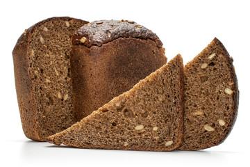 Group of two halves two slices of fresh baked dark bread isolated on white background
