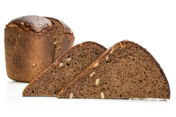 Group of two halves two slices of fresh baked dark bread isolated on white background