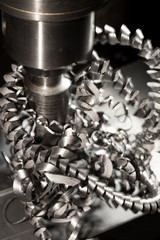 Obraz na płótnie Canvas drilling holes in metal on industrial equipment