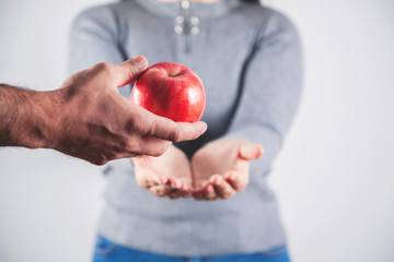 woman and man hand  apple